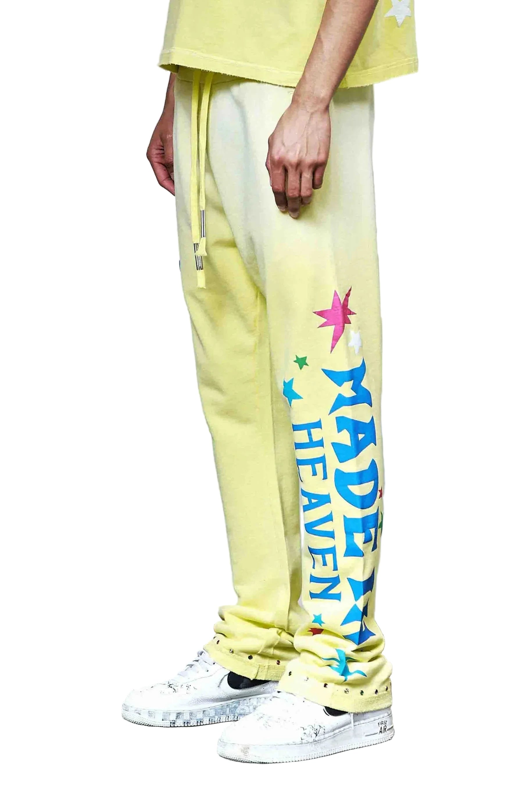 First Row MIH Konpeito Flare yellow stack jogger pants with jewel stud detailing and elastic drawcord waistband