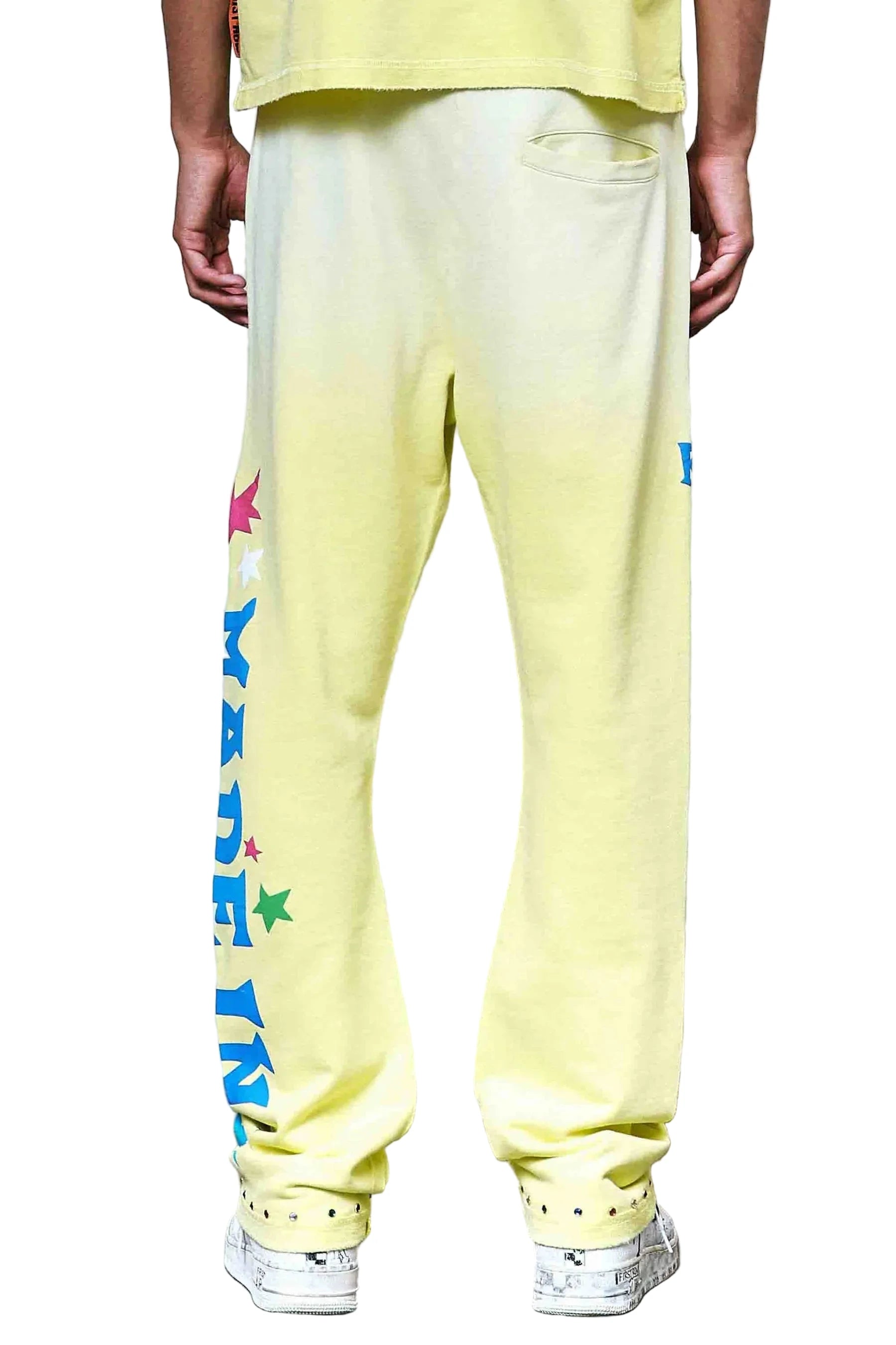 First Row MIH Konpeito Flare yellow stack jogger pants with jewel stud detailing and elastic drawcord waistband