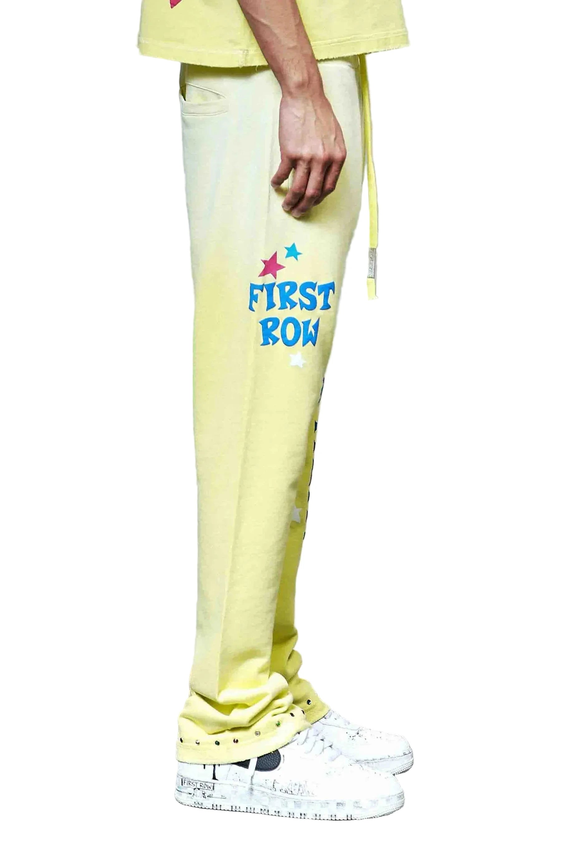 First Row MIH Konpeito Flare yellow stack jogger pants with jewel stud detailing and elastic drawcord waistband