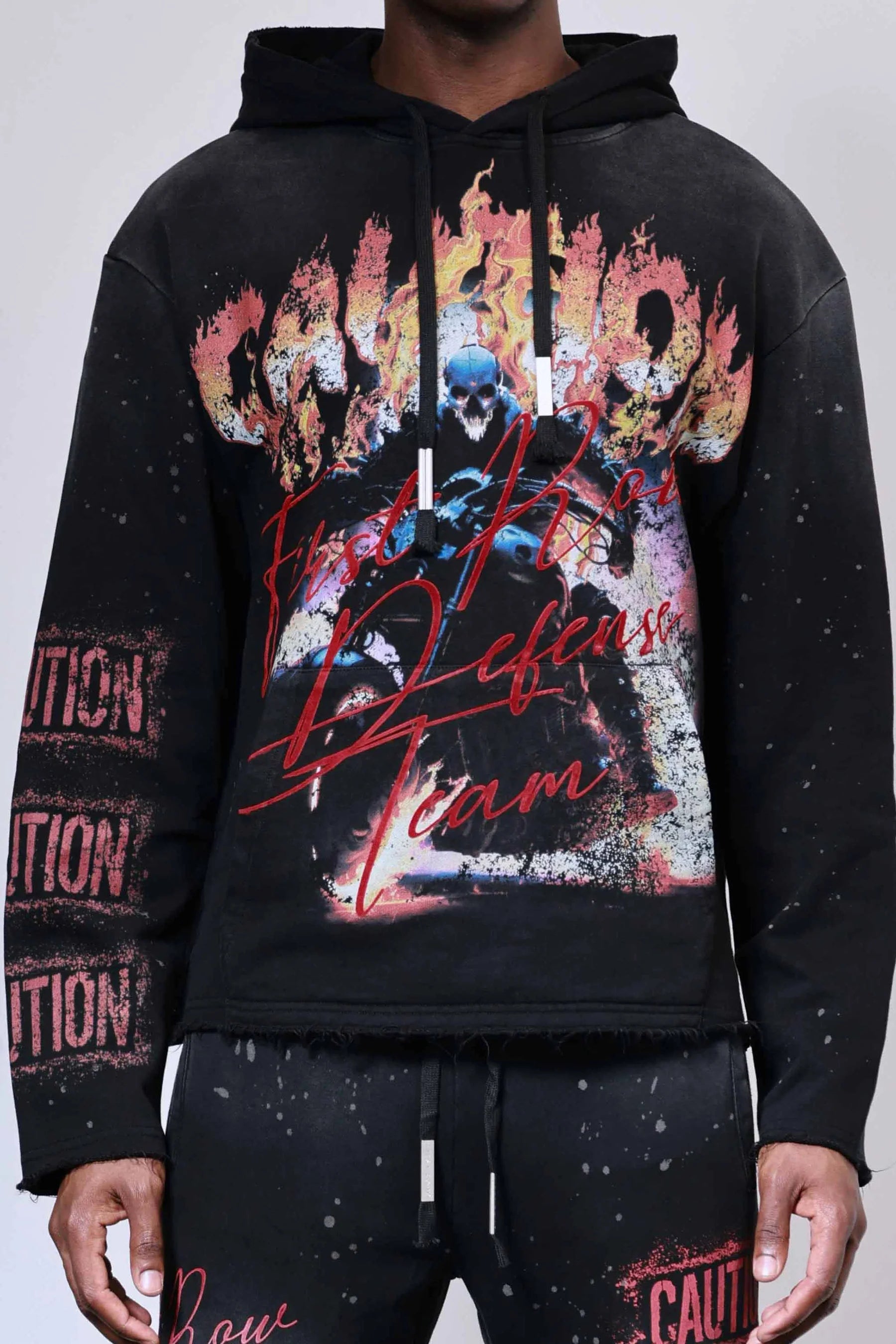 First Row Caution Not So Quiet Ghost Rider Flames open-bottom sweat hoodie with flock detailing, slightly oversized fit, raw edge hem, kanga pocket, and adjustable drawstring hood