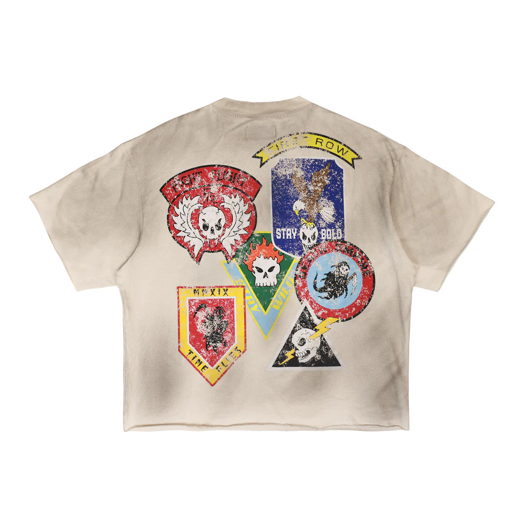 "First Row A washed crop mini terry t-shirt in 100% cotton, featuring a raw-edge hem and patch detail, styled in a relaxed cropped fit."