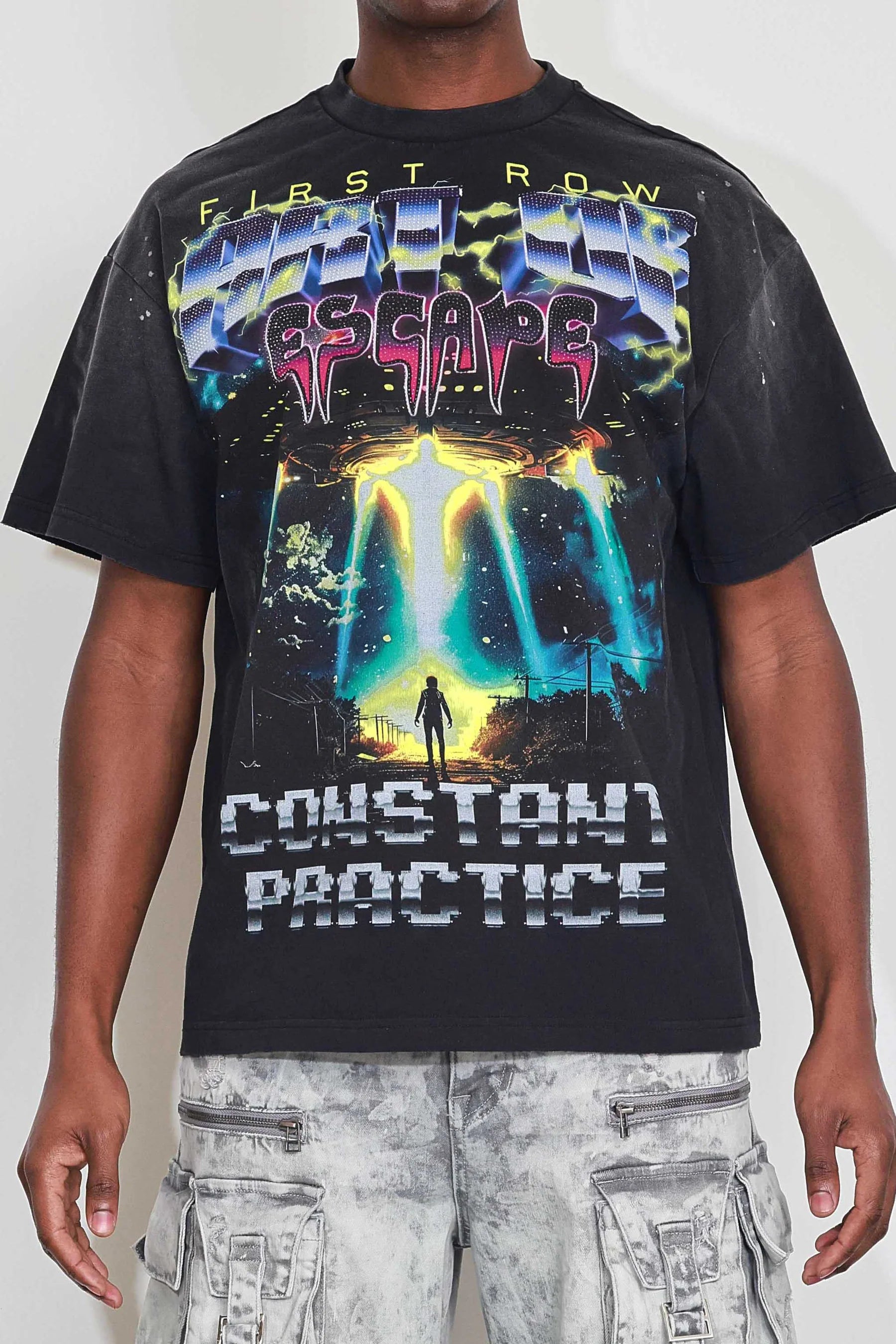 "First Row Art of Escape Tour Tee with heavy washed graphic, stone detail, and distressed hem."