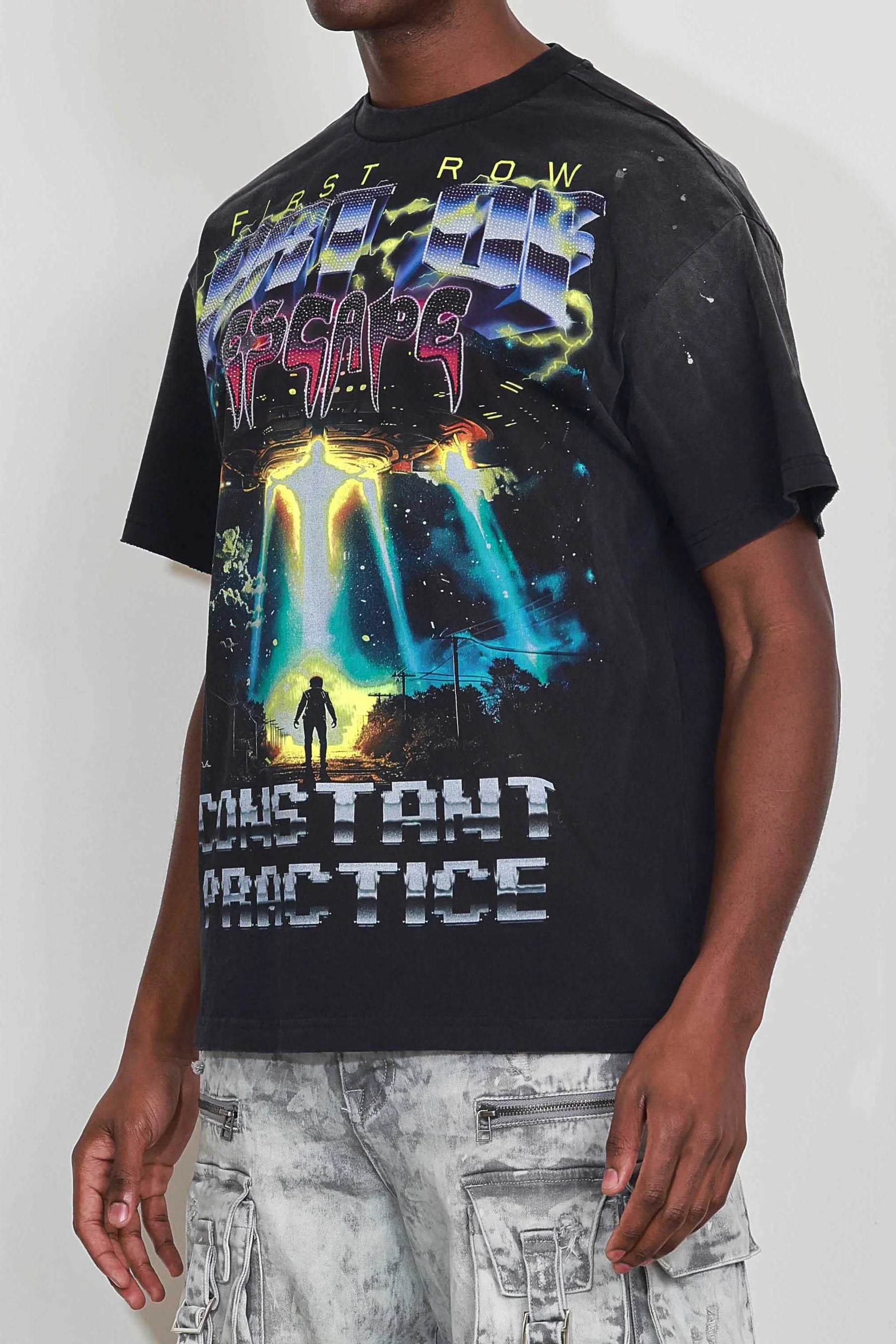 "First Row Art of Escape Tour Tee with heavy washed graphic, stone detail, and distressed hem."