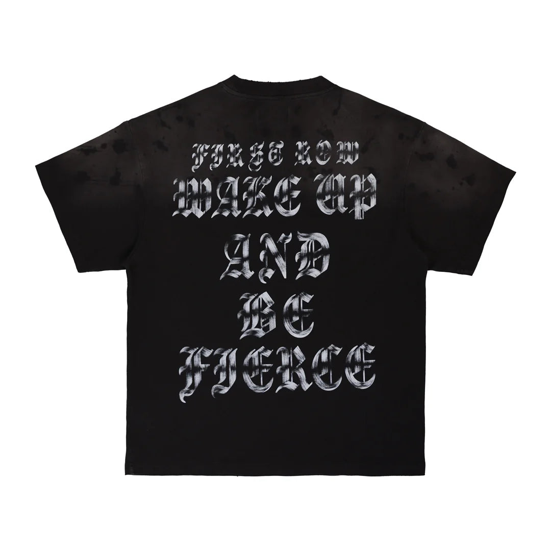"First Row Wake Up and Be Fierce appliqué graphic tee with embroidery, stud details, and bleach splash wash effect."