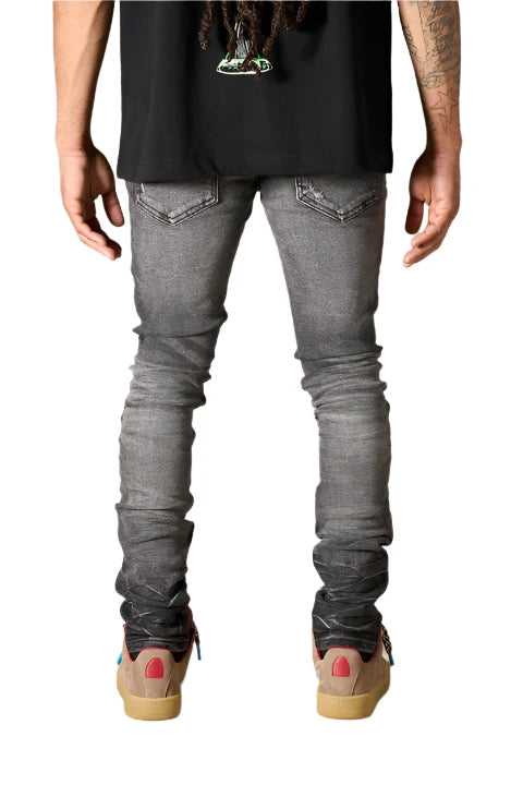 Faded black SERENEDE® FUME jeans with tapered fit, embroidered logo, and leather patch in a smoke-washed finish.