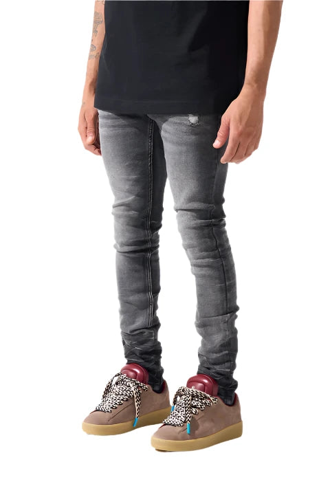 Faded black SERENEDE® FUME jeans with tapered fit, embroidered logo, and leather patch in a smoke-washed finish.