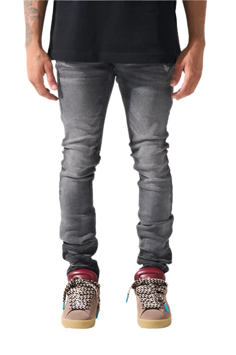 Faded black SERENEDE® FUME jeans with tapered fit, embroidered logo, and leather patch in a smoke-washed finish.