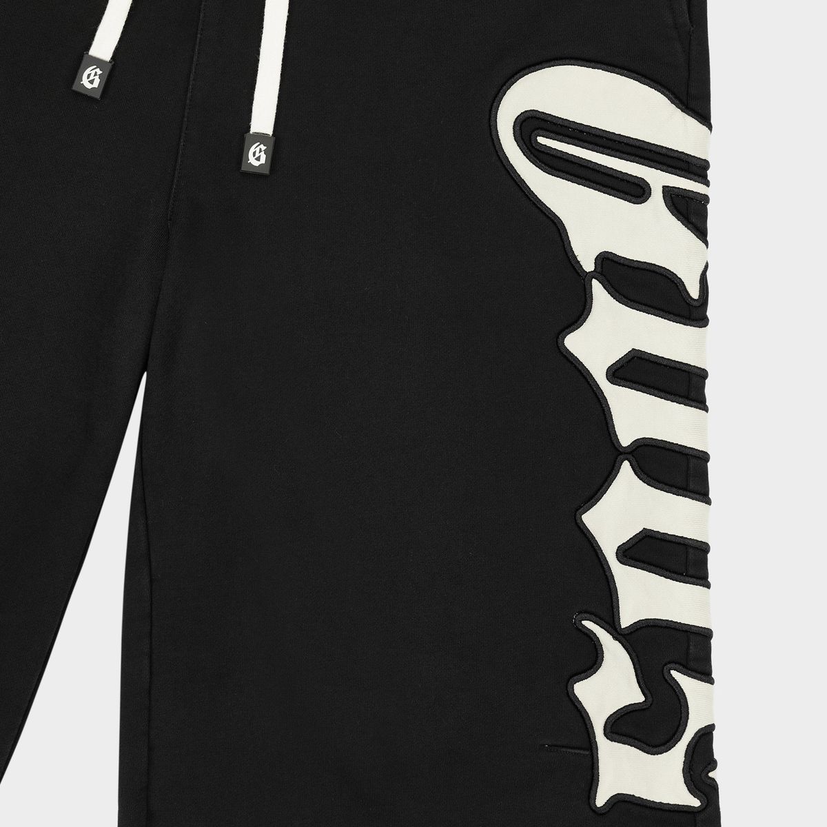 Godspeed OG 3Qtr shorts featuring heavyweight French terry cotton, racing-inspired piping, oversized side logo, and a relaxed extended-length fit.