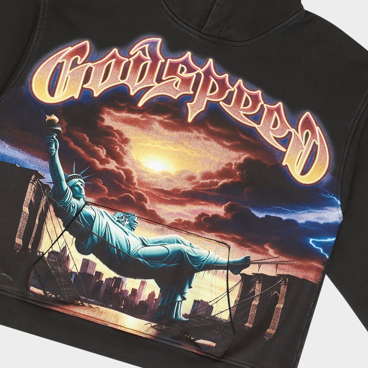 Black hoodie with a graphic of the Statue of Liberty and 'Goodspeed' text on a cloudy sky background.