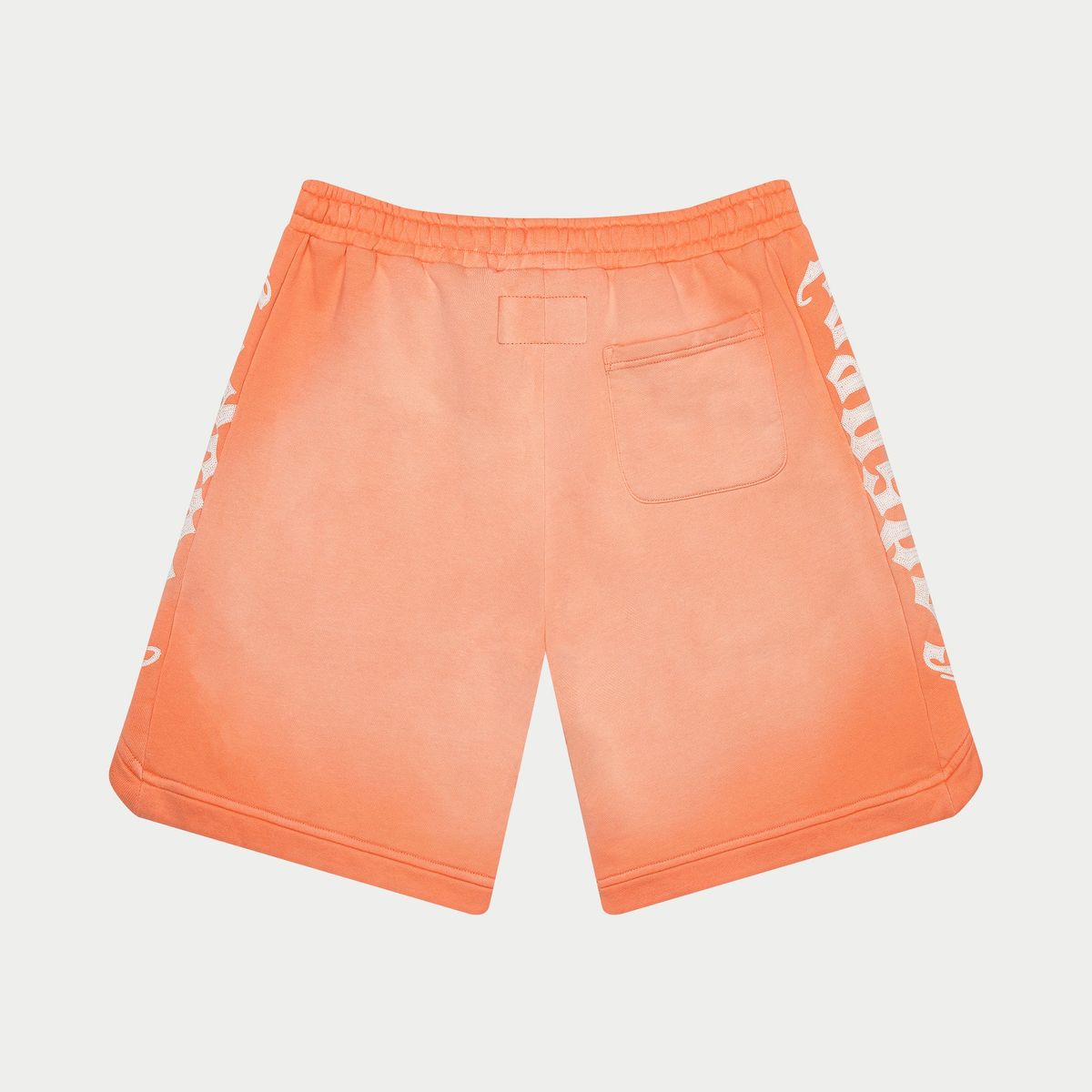 Orange shorts with white text on a light gray background