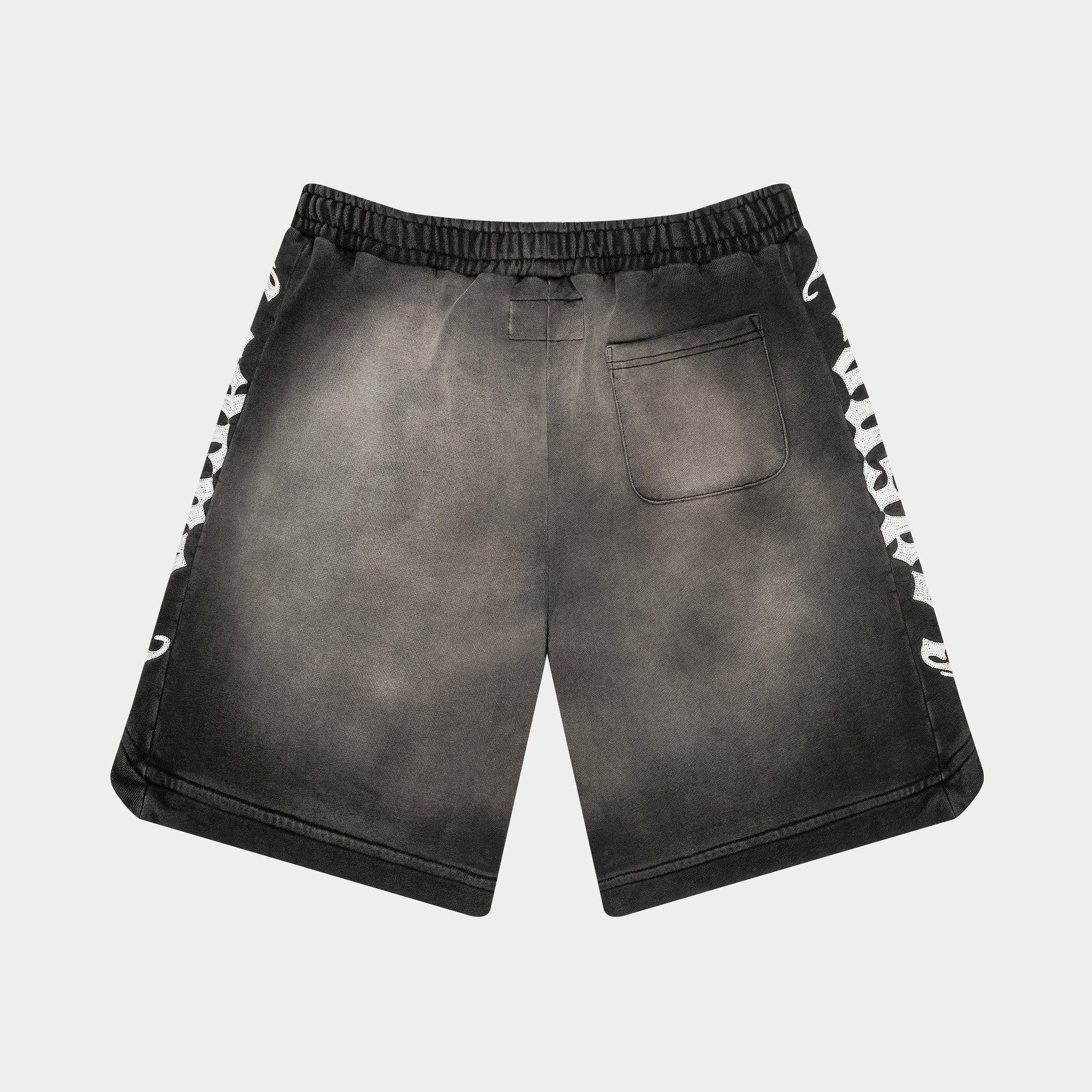 Black shorts with white text on a light gray background