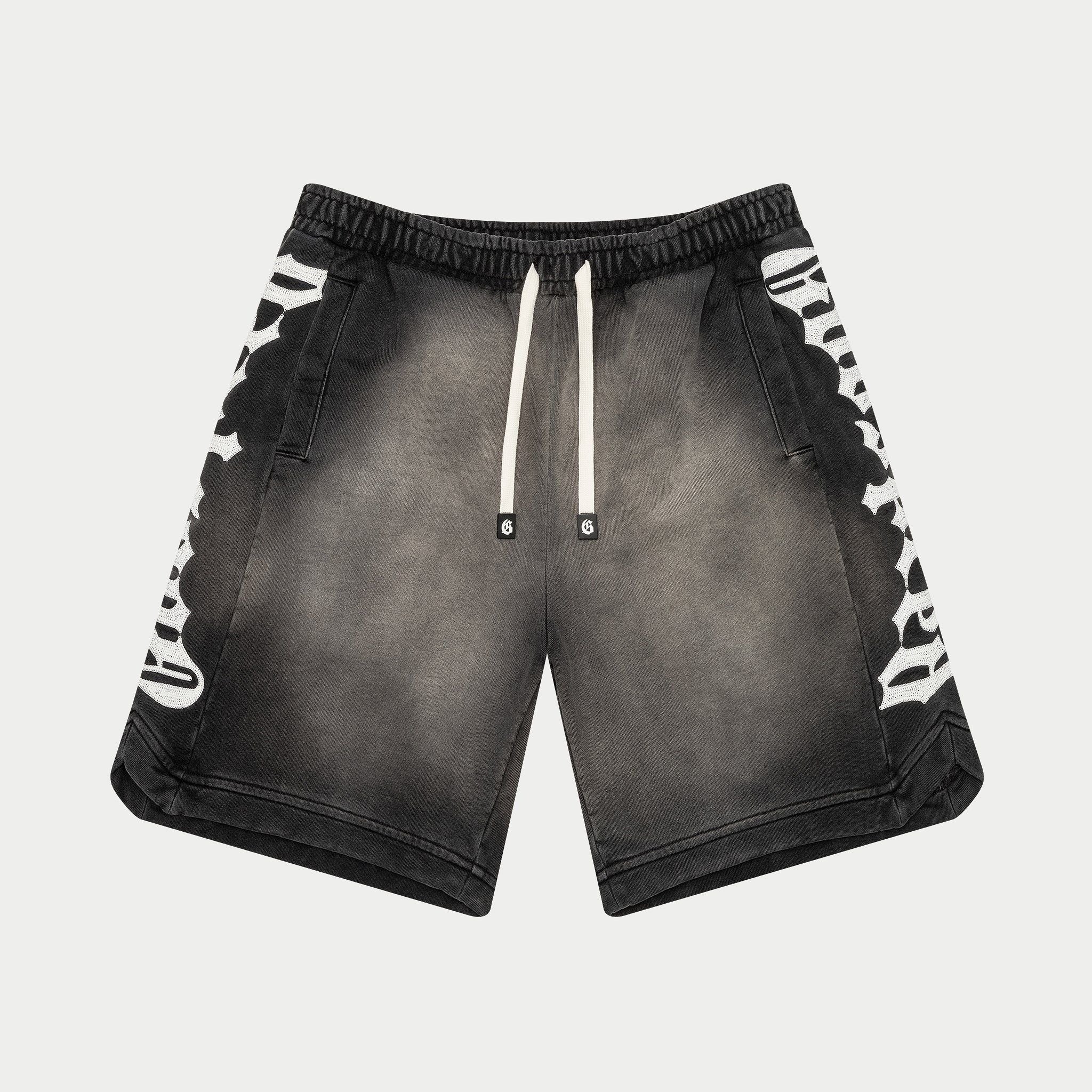 Black shorts with white patterns on a light gray background