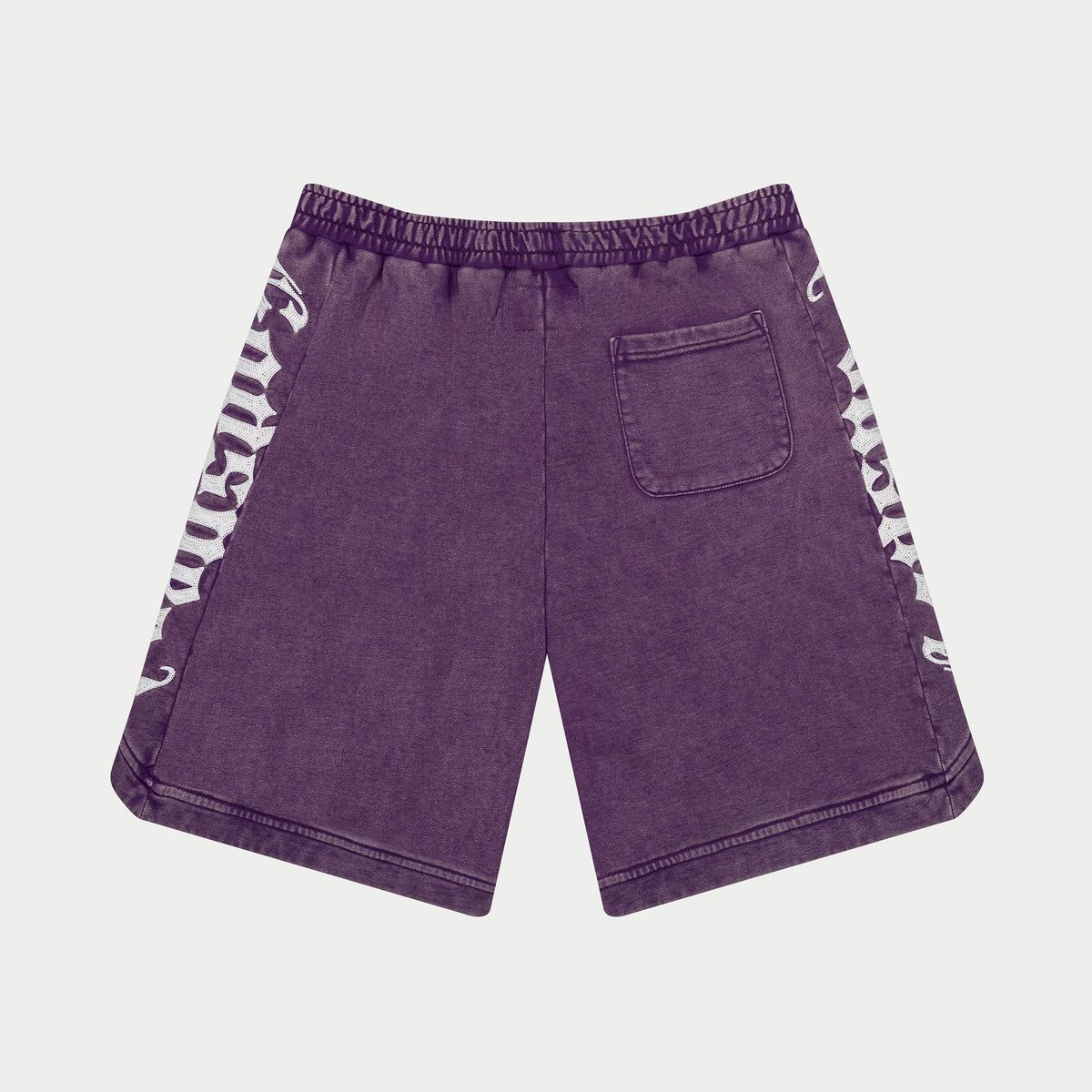 Purple shorts with white patterns on a light gray background