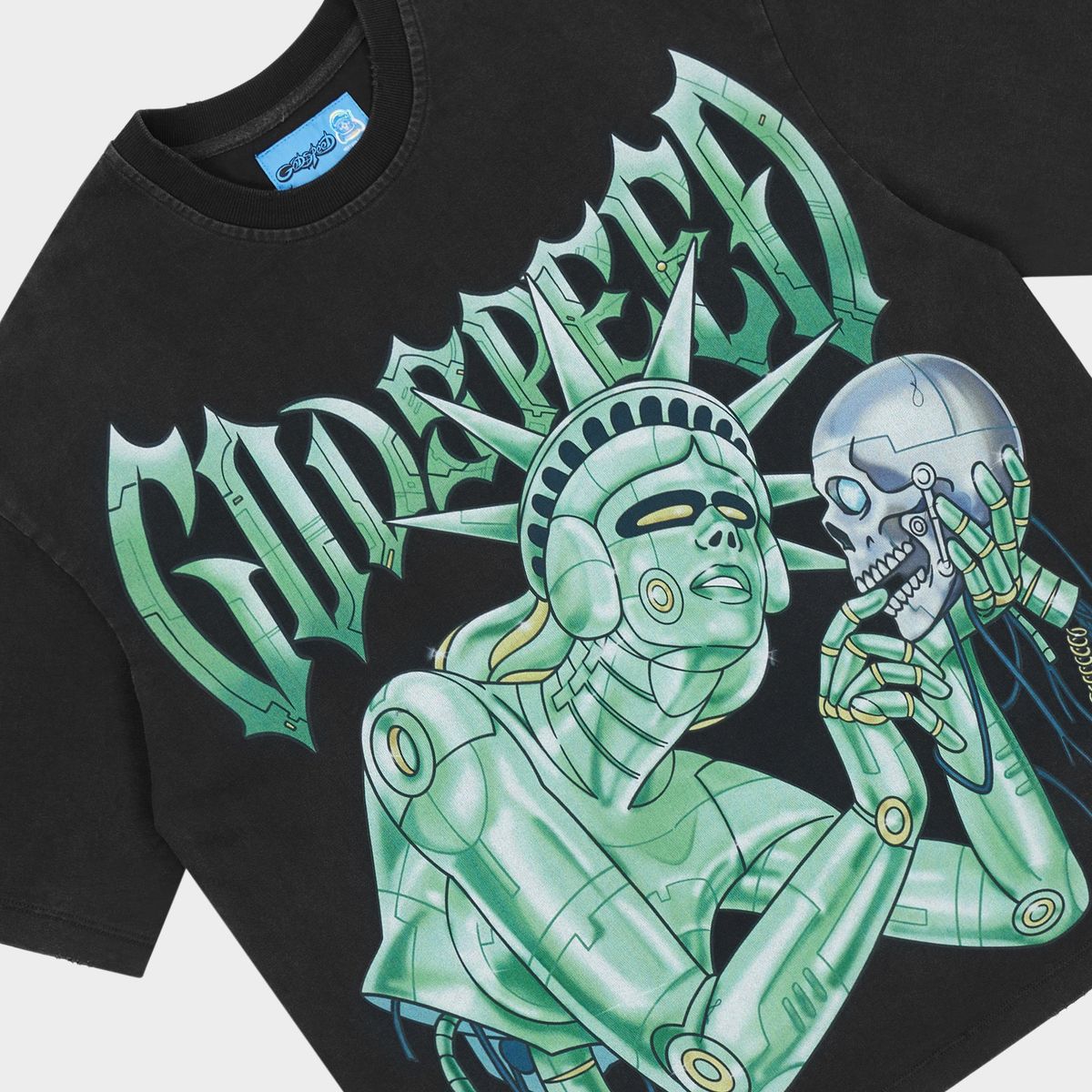 Godspeed Freedoms Protocol T-shirt featuring bold graphic artwork, stone crown detailing, and premium mid-weight washed fabric.