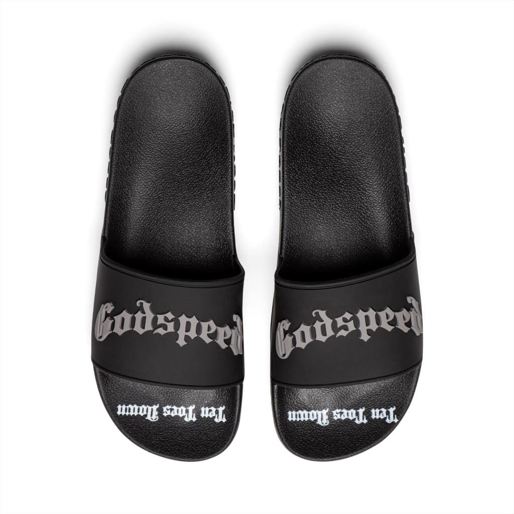 Black Godspeed OG Logo Slides featuring “DON’T BRING SAND TO THE BEACH” tagline with branded box and dust bag.