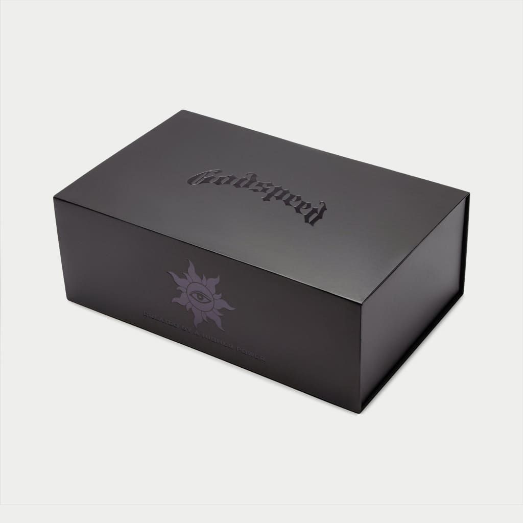 Black Godspeed OG Logo Slides featuring “DON’T BRING SAND TO THE BEACH” tagline with branded box and dust bag.