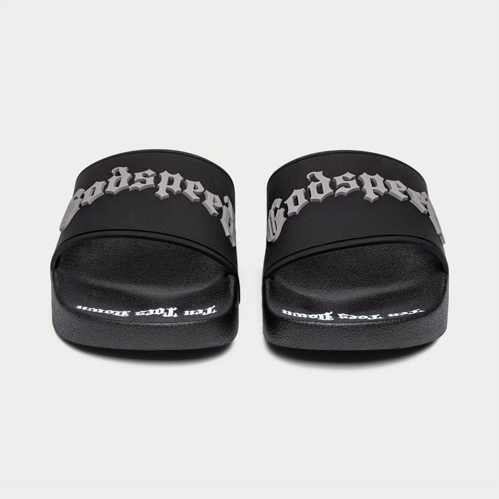 Black Godspeed OG Logo Slides featuring “DON’T BRING SAND TO THE BEACH” tagline with branded box and dust bag.