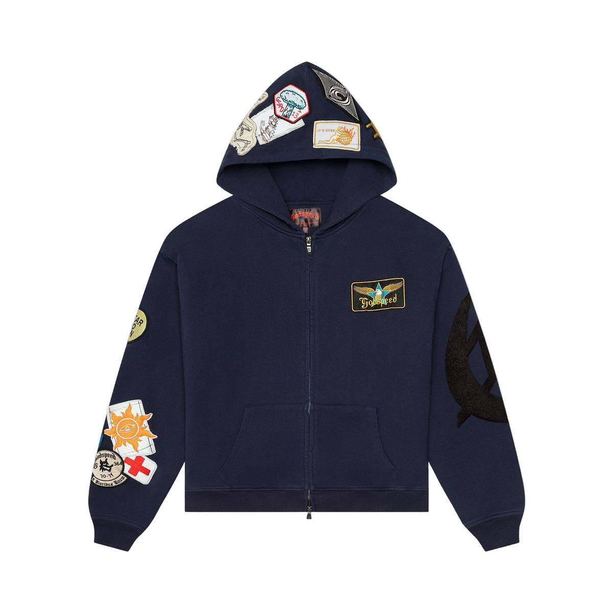The GS Squadron Hoodie in Navy delivers a clean mix of comfort and utility. Made from medium-weight 100% cotton, it offers a soft, breathable feel ideal for everyday wear. Distinctive patch details on the sleeve and hood give it a signature Godspeed look, adding character without sacrificing simplicity. Finished with a full zip front and a relaxed fit, this hoodie brings effortless style to any rotation.