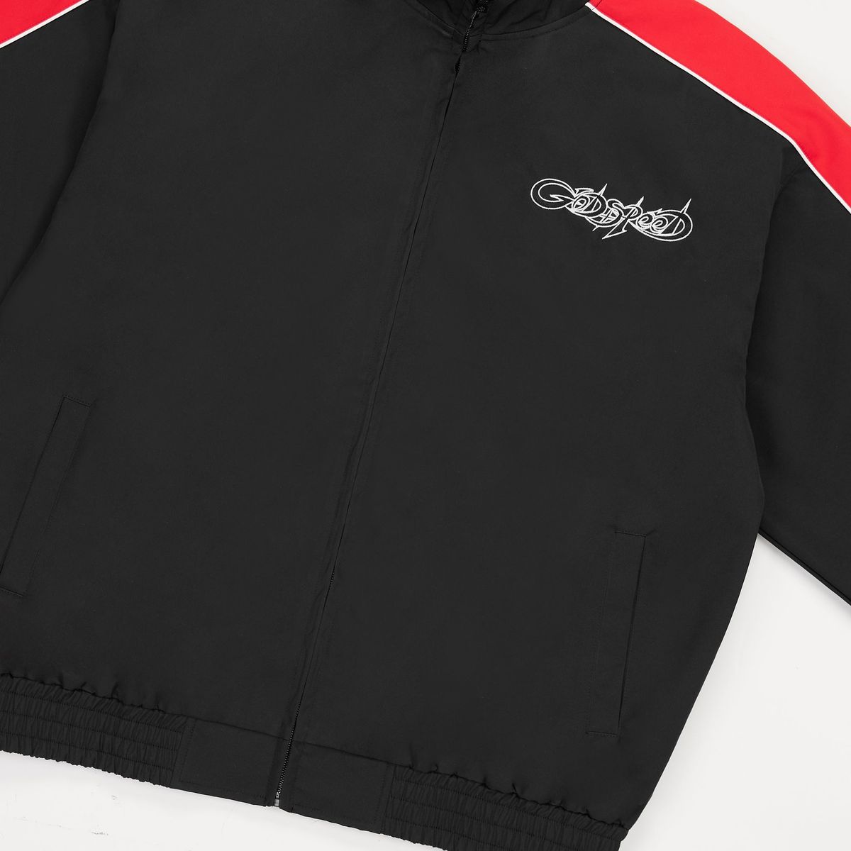 Godspeed GT tracksuit in black and red with nylon fabric, mesh backing, and matching top and bottom set