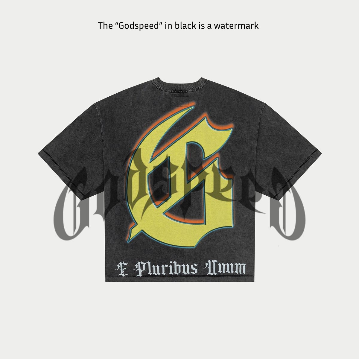 Black t-shirt with colorful graphic design on a light gray background