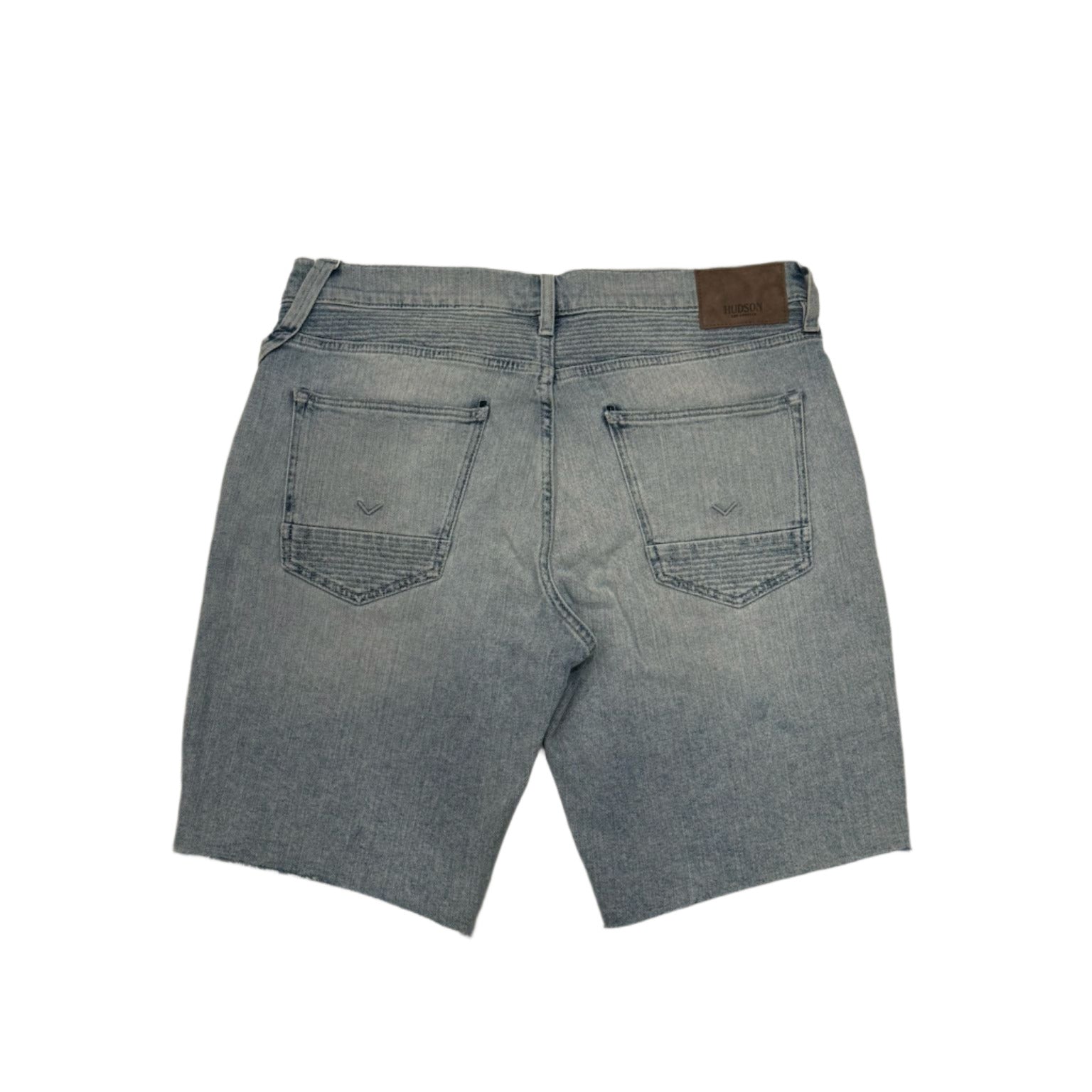 Blue denim shorts on a marble floor