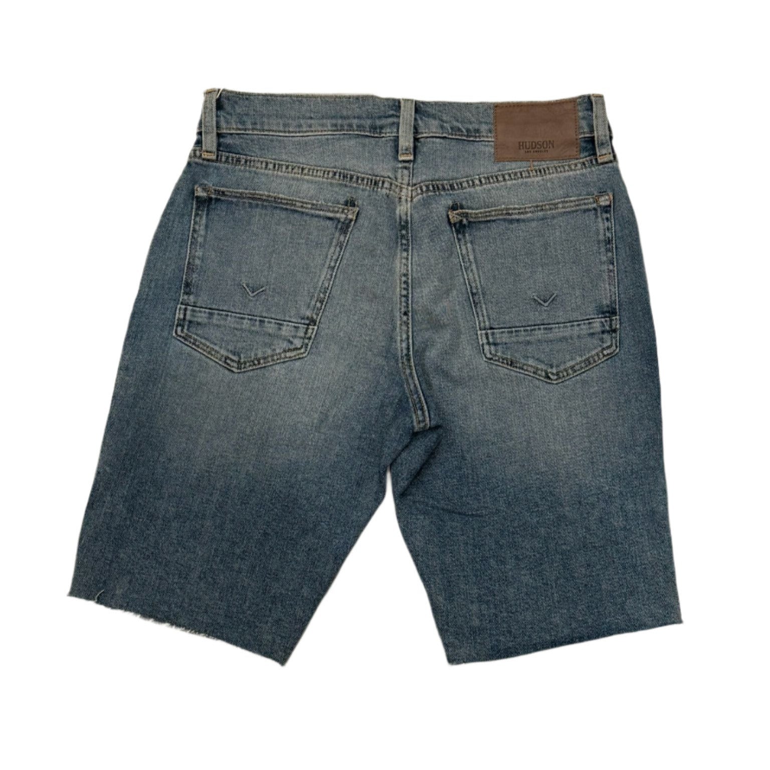 Back view of blue denim shorts on a white background