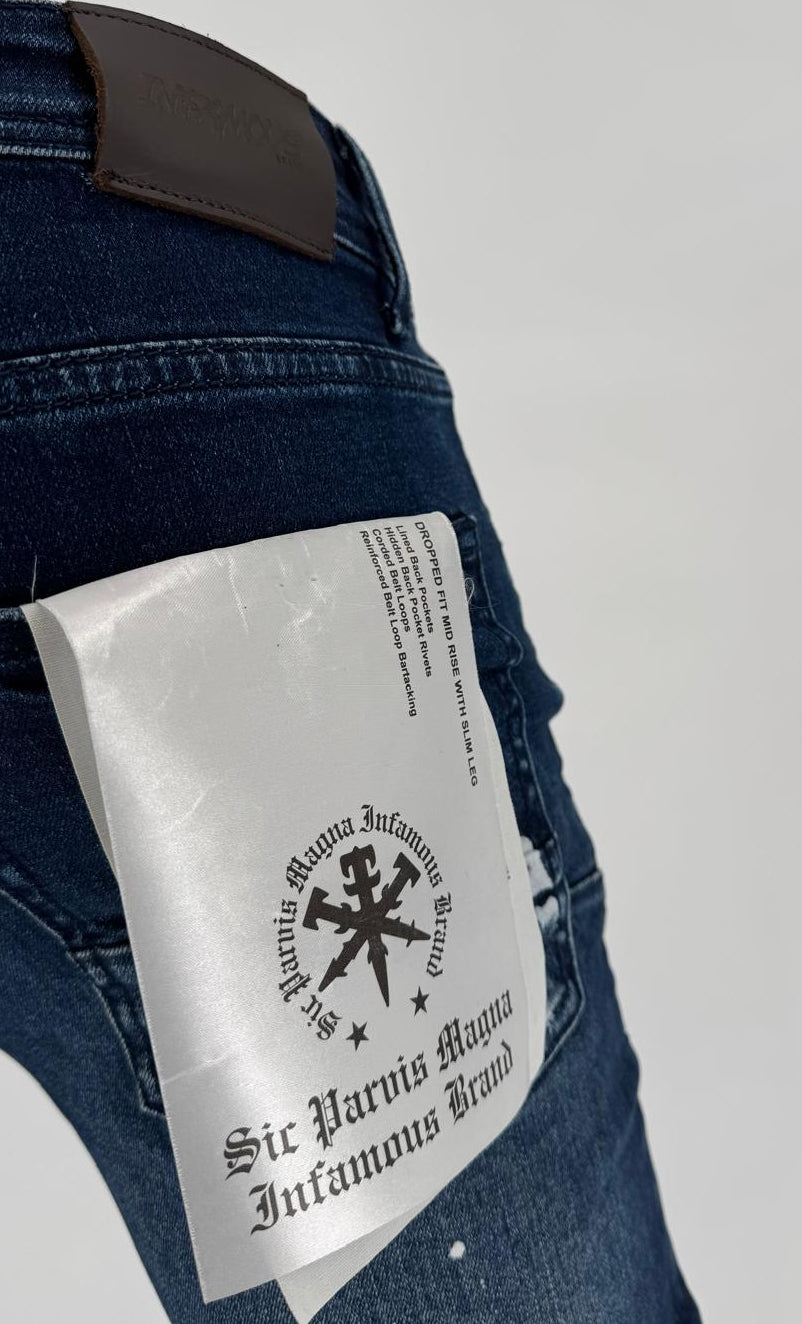 Make a bold statement with the Infamous Jeans in Dark Blue – a modern denim staple built for comfort, durability, and street-ready style. Featuring a classic slim fit with a tapered leg, these jeans offer a clean and structured look that suits any occasion, from casual weekends to late-night outings.
