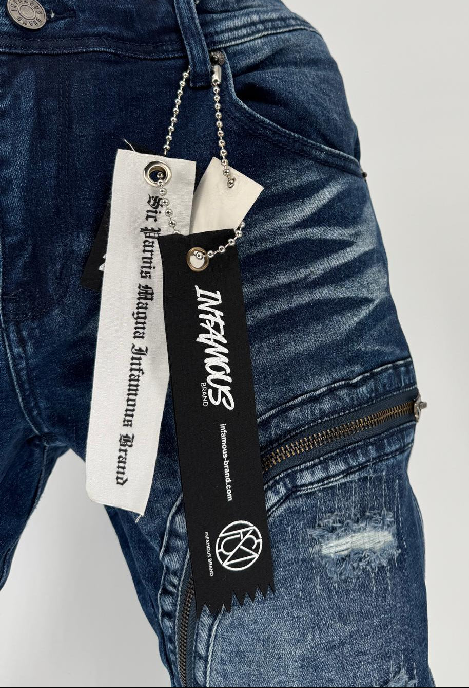 Elevate your everyday look with the Infamous Jeans in Dark Blue, a refined essential that defines effortless confidence and modern streetwear appeal. Crafted with precision from premium stretch-denim, these jeans deliver the perfect balance of structure, flexibility, and durability — designed to move with you through every moment.
