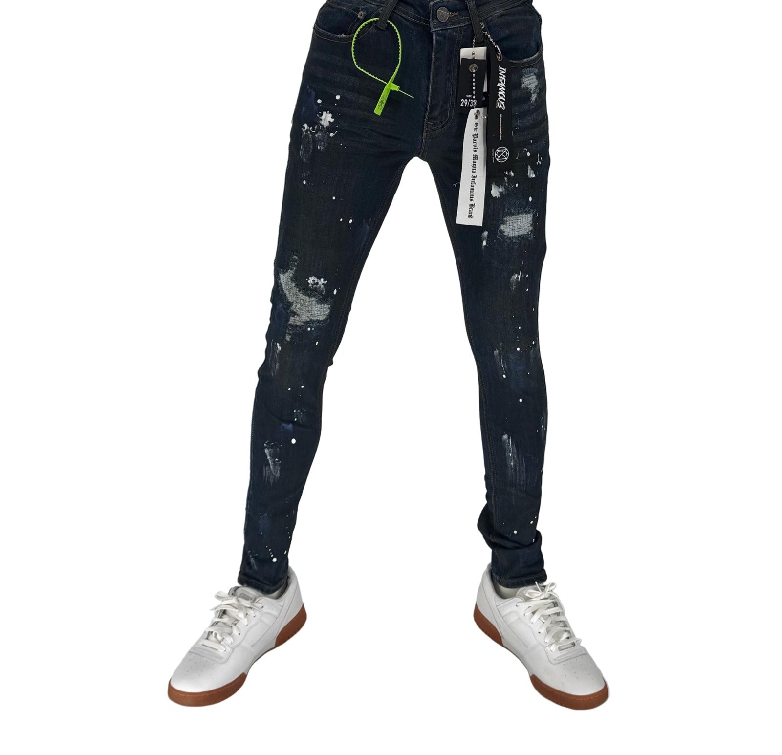 The Infamous Dark Blue Skinny Jeans bring timeless denim style with a sharp, modern edge. Designed with a deep indigo wash, these jeans offer a clean, versatile look that can be dressed up or down. The skinny fit hugs your legs for a streamlined silhouette, while the stretch fabric ensures comfort all day long.