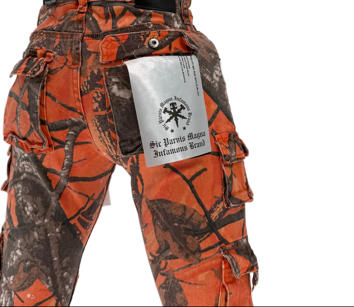 Turn up the volume on your streetwear game with the Infamous Stacked Jeans in Orange Camo – a bold, unapologetic take on a modern classic. Featuring a stacked-leg design with extra length for that signature stacked look, these jeans bring standout energy to any outfit.