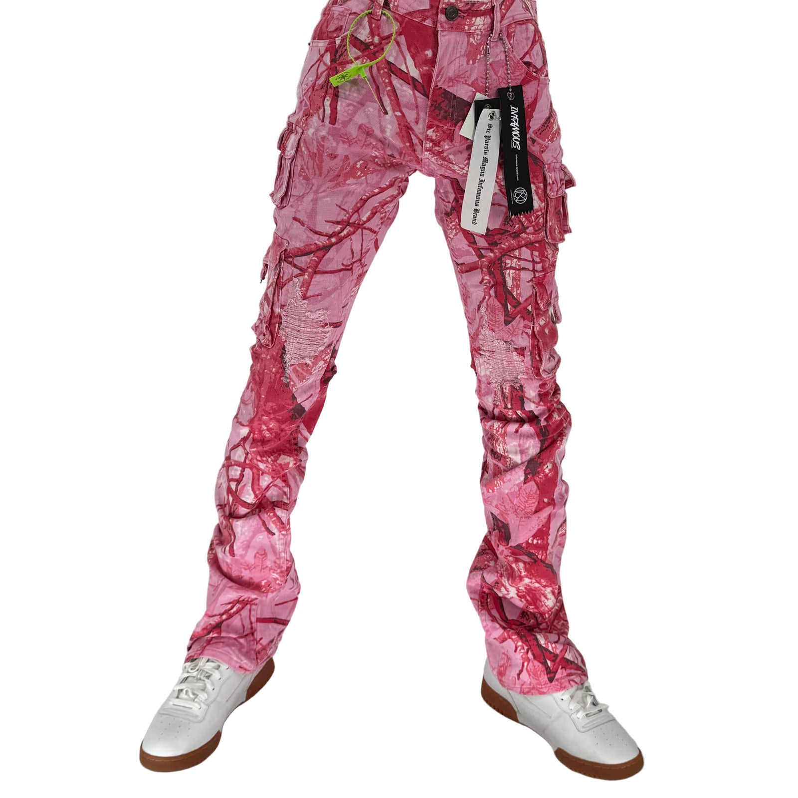 Turn heads and break the mold with the Infamous Stacked Jeans in Pink Camo – the ultimate statement piece for bold, fashion-forward styling. These stacked jeans feature a tapered fit with extended length for a signature stacked effect at the ankles, bringing runway-level flair to your everyday look.
