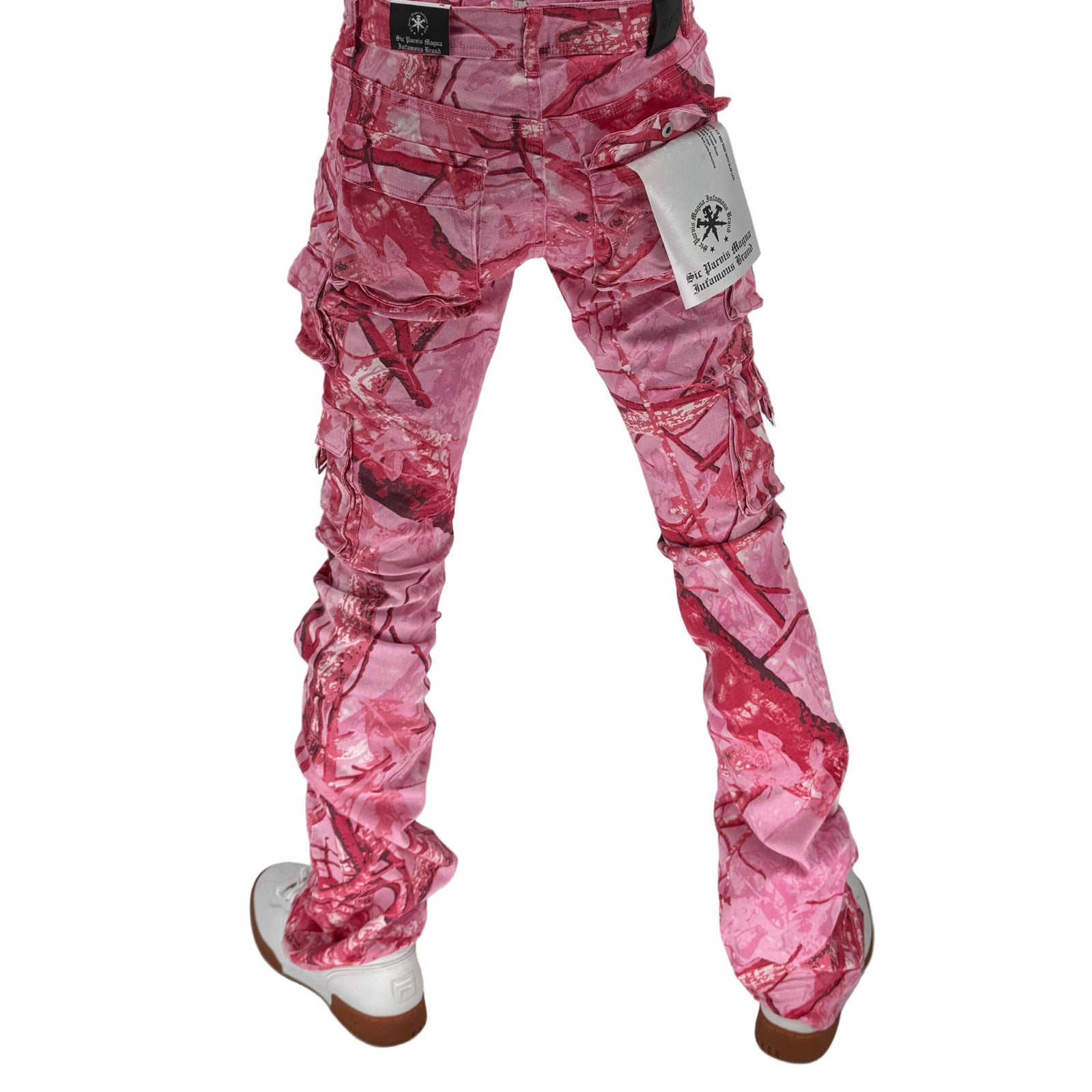 Turn heads and break the mold with the Infamous Stacked Jeans in Pink Camo – the ultimate statement piece for bold, fashion-forward styling. These stacked jeans feature a tapered fit with extended length for a signature stacked effect at the ankles, bringing runway-level flair to your everyday look.