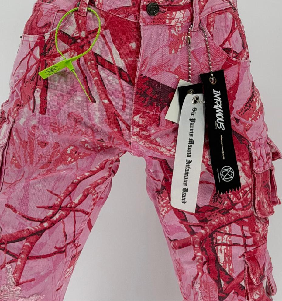 Turn heads and break the mold with the Infamous Stacked Jeans in Pink Camo – the ultimate statement piece for bold, fashion-forward styling. These stacked jeans feature a tapered fit with extended length for a signature stacked effect at the ankles, bringing runway-level flair to your everyday look.