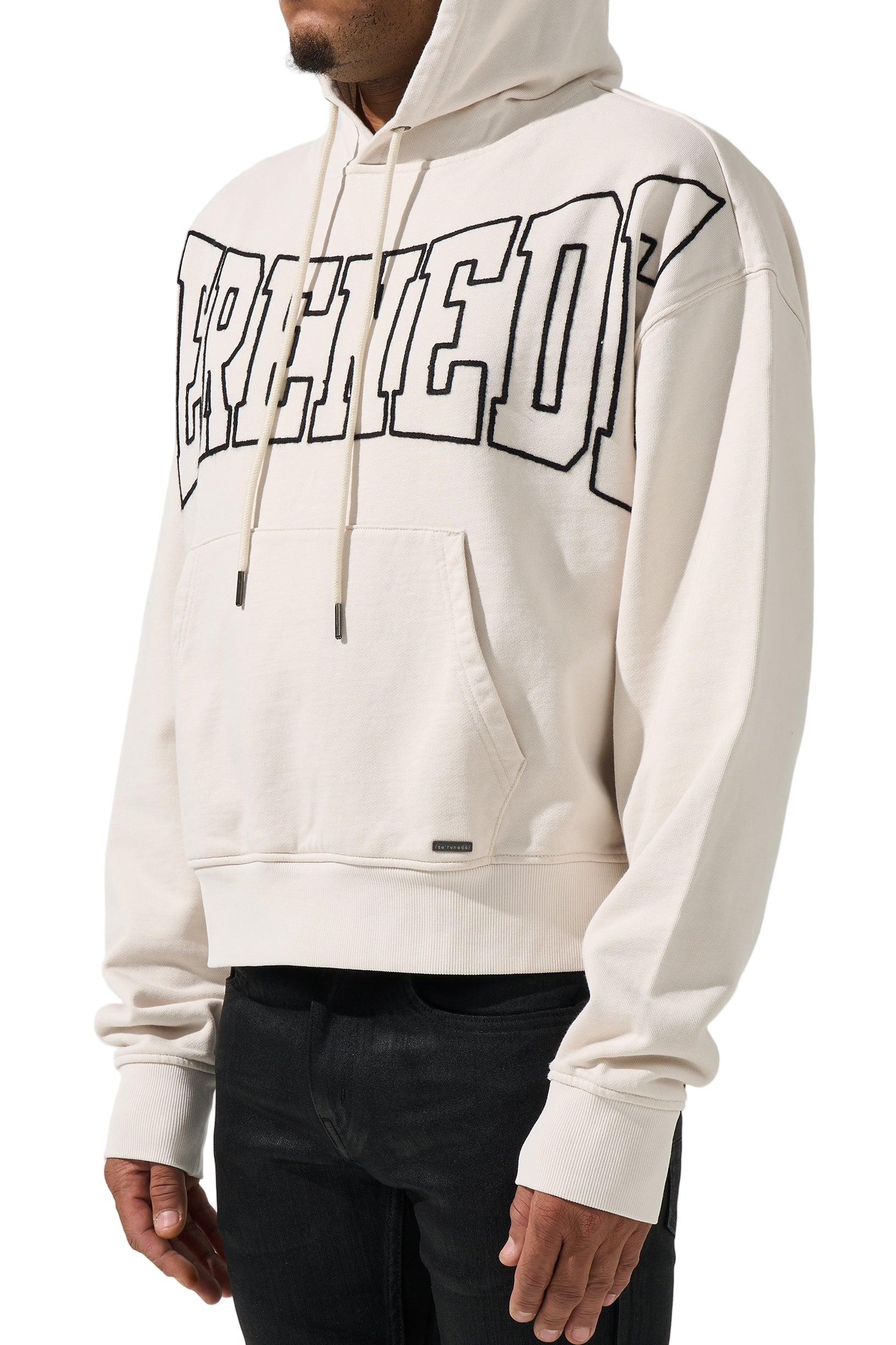 SERENEDE® LEGACY Ivory Hoodie with black outlined chest branding, kangaroo pocket, and relaxed fit.