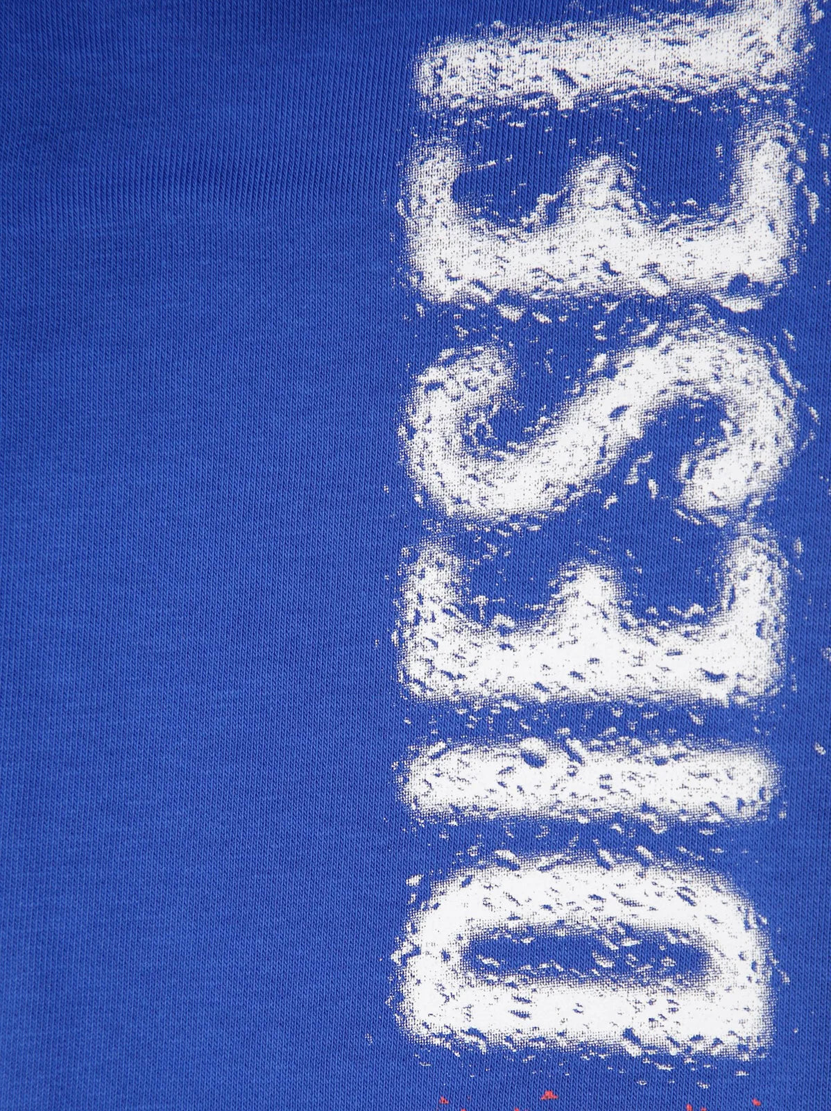 Diesel kids’ blue brushed cotton trousers with elasticated waist, side pockets, and elasticated ankles.