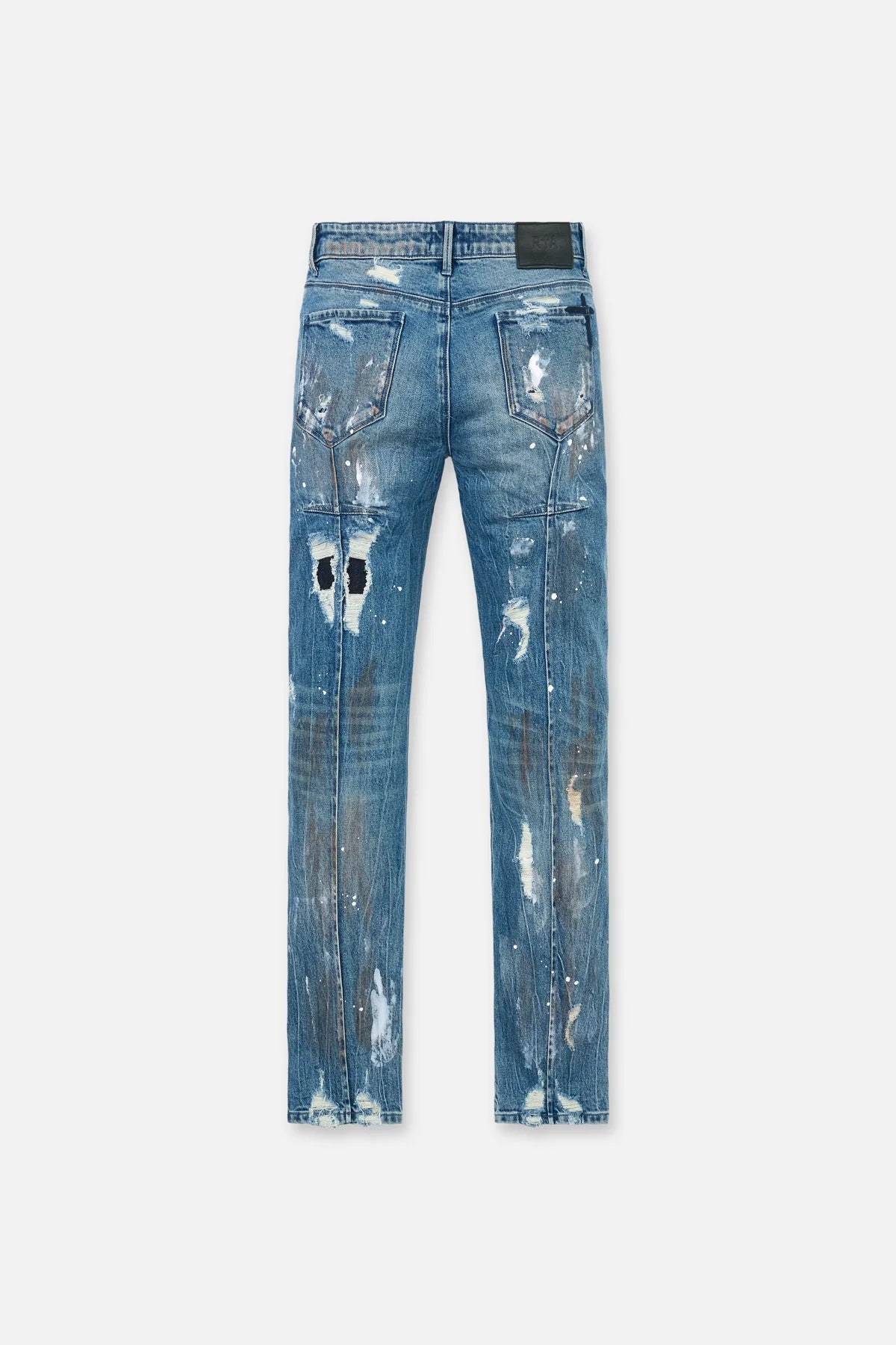 RTA Clayton Skinny Jean in Glitch Blue with distressed finish, paint splatter, embossed logo, and dagger seams.