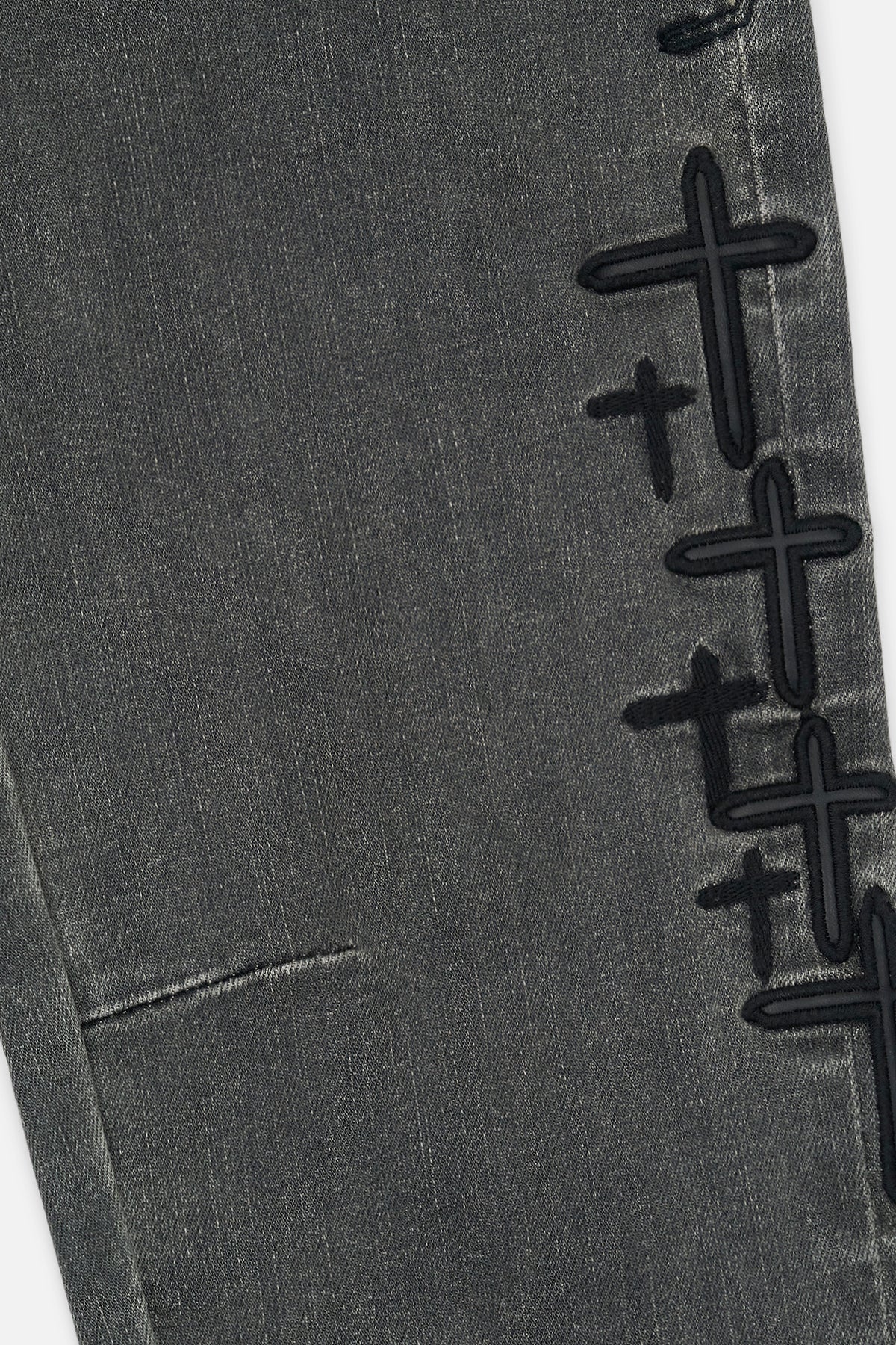 RtA Benson skinny jeans in Clouded Mist with embroidered cross patches and RtA logo on the back pocket.