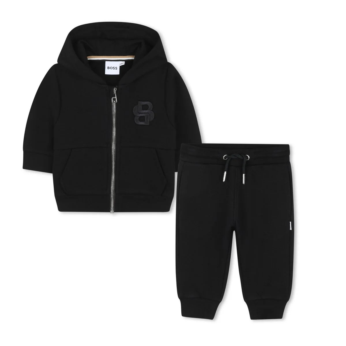 This Hugo Boss baby tracksuit blends sporty comfort with elevated design. The zip-up hoodie and matching joggers keep your little one cozy, while signature details deliver that unmistakable BOSS touch.