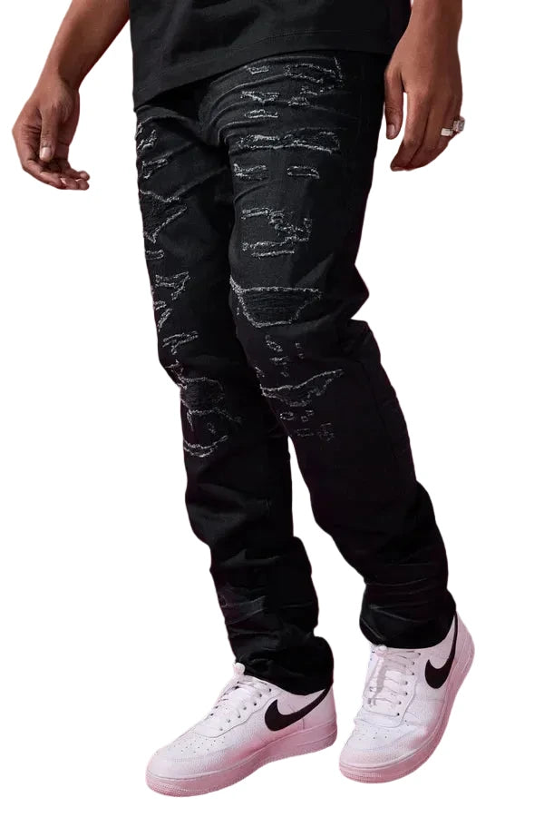 Dyckman straight fit denim jeans in polished black with glossy coated finish and rip-and-repair detailing.