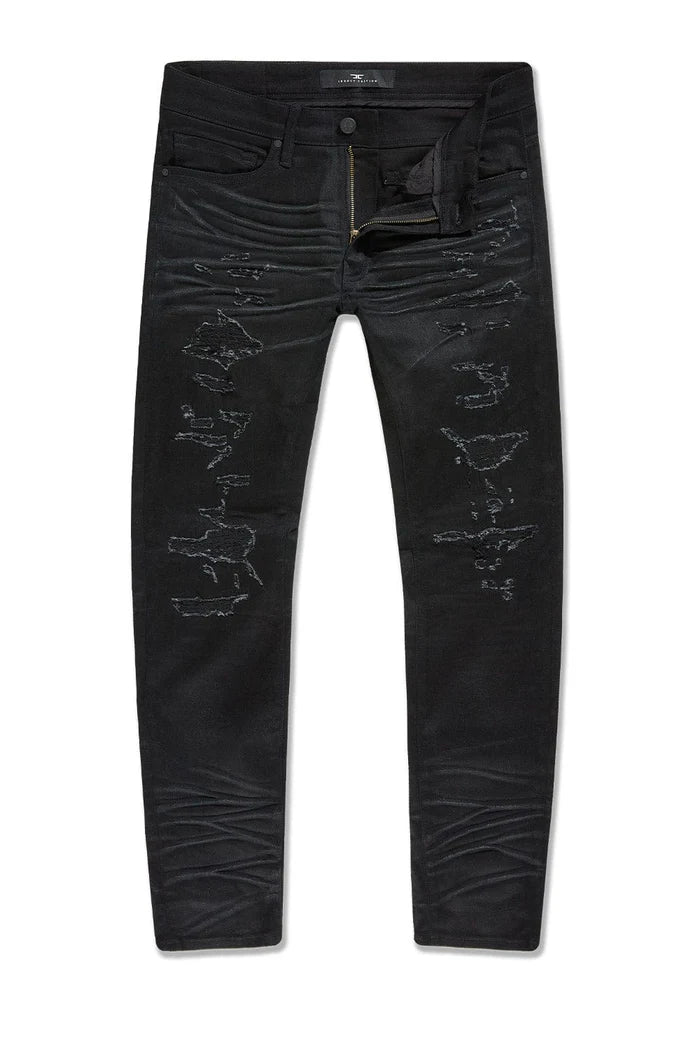 Dyckman straight fit denim jeans in polished black with glossy coated finish and rip-and-repair detailing.
