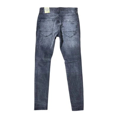Extended-length flare denim pants with stacked leg, 3D baked wrinkles, and rip-and-repair detailing