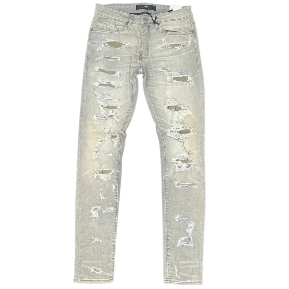Extended-length flare denim pants with stacked leg, 3D baked wrinkles, and rip-and-repair detailing