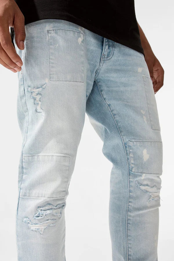  Skinny fit jeans with rip and repair details, deep pockets, and stretch denim for comfort.