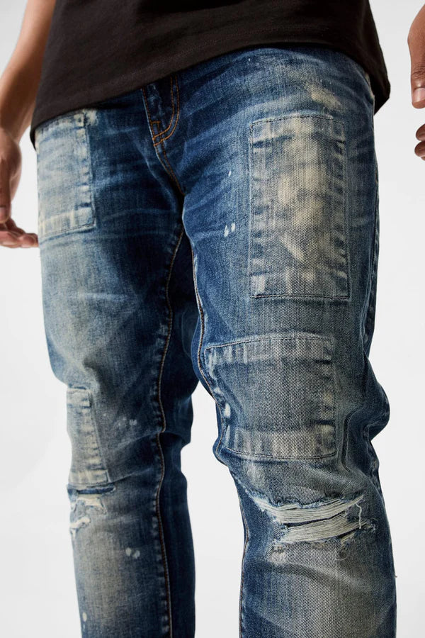  Skinny fit jeans with rip and repair details, deep pockets, and stretch denim for comfort.