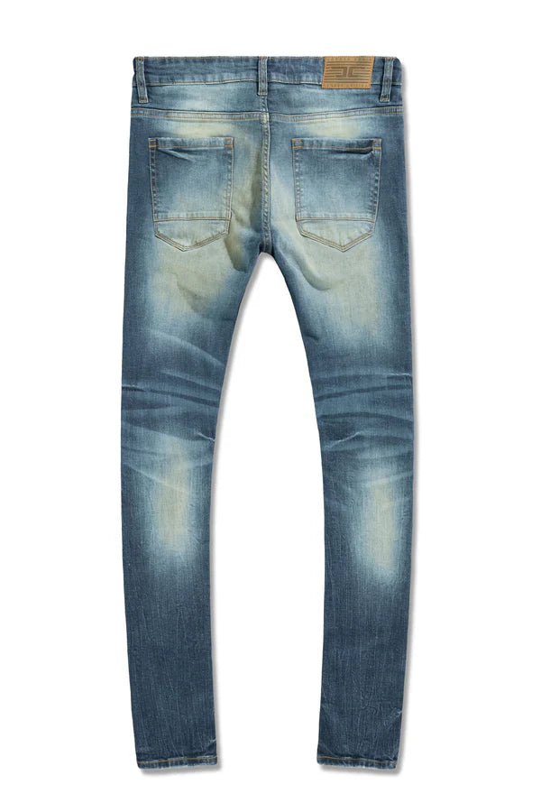 Jordan Craig Recon skinny fit denim in desert wash with rip and repair detailing, camo backing, and stretch denim streetwear style
