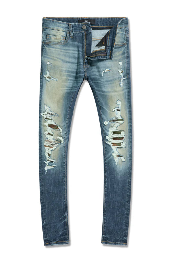 Jordan Craig Recon skinny fit denim in desert wash with rip and repair detailing, camo backing, and stretch denim streetwear style
