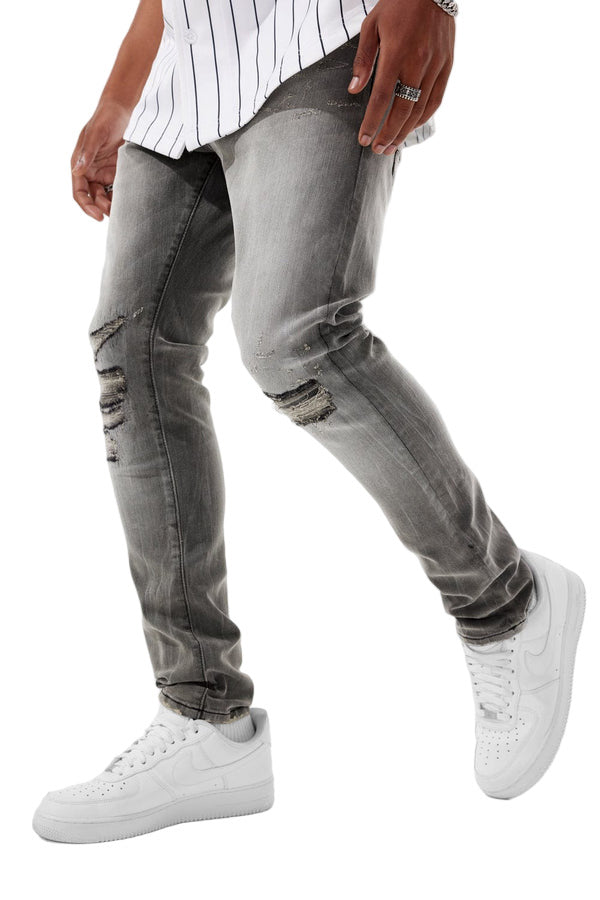 Sean Slim Taper Fit Jeans with vintage wash, rip-and-repair detailing, and unique distressing