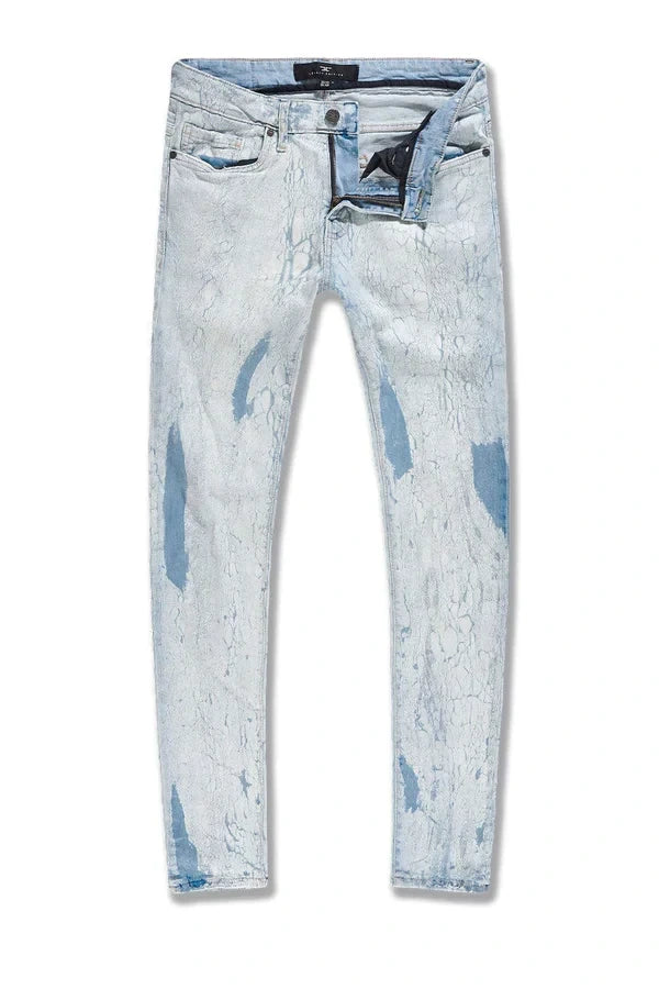  Slim taper fit jeans with cracking texture, regular rise, and stretch fabric for comfort.