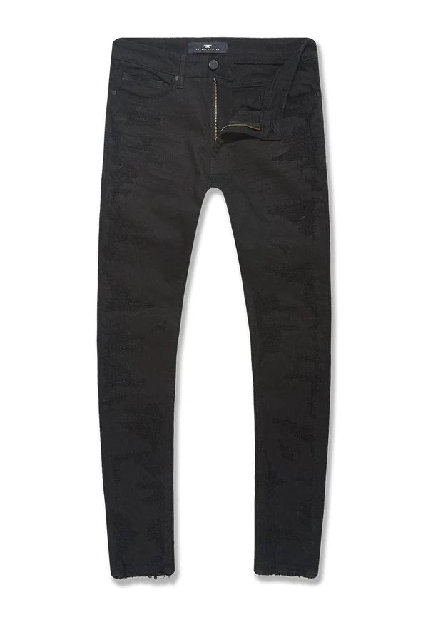 The Sean slim taper jeans with rip and repair design and unique distressing