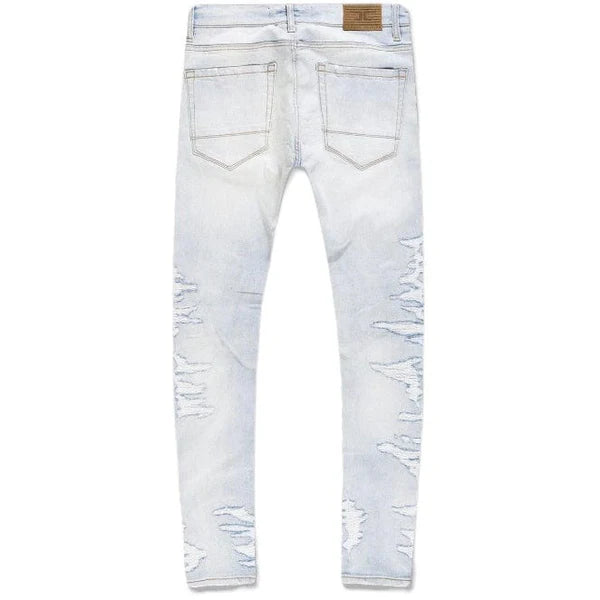 Extended-length flare denim pants with stacked leg, 3D baked wrinkles, and rip-and-repair detailing
